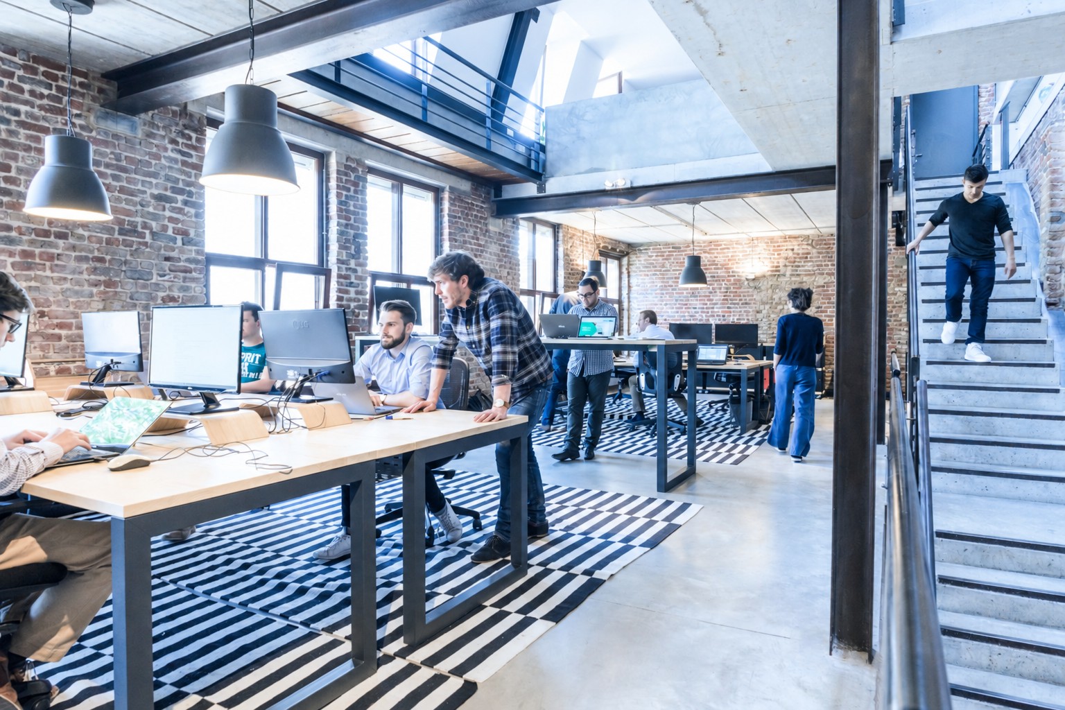 People working together at desks in an open office